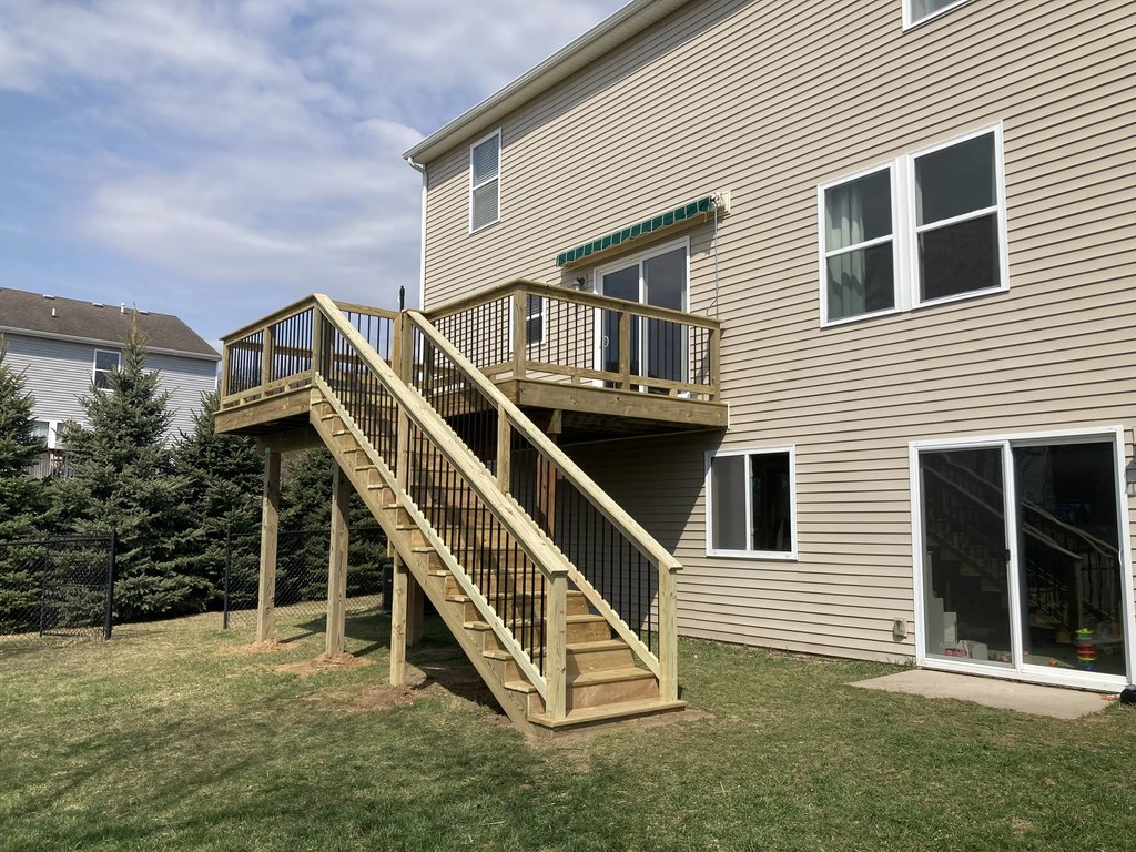 Elevated Pine Deck with Tall Staircase & Black Railings — thumbnail 2