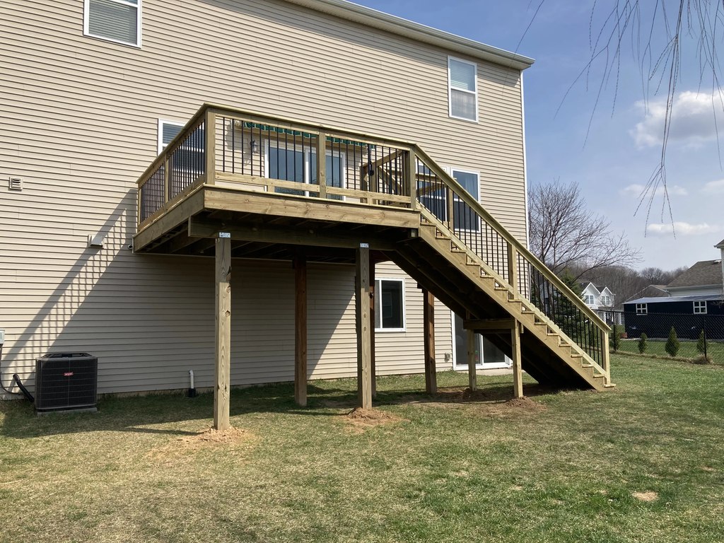 Elevated Pine Deck with Tall Staircase & Black Railings — thumbnail 3