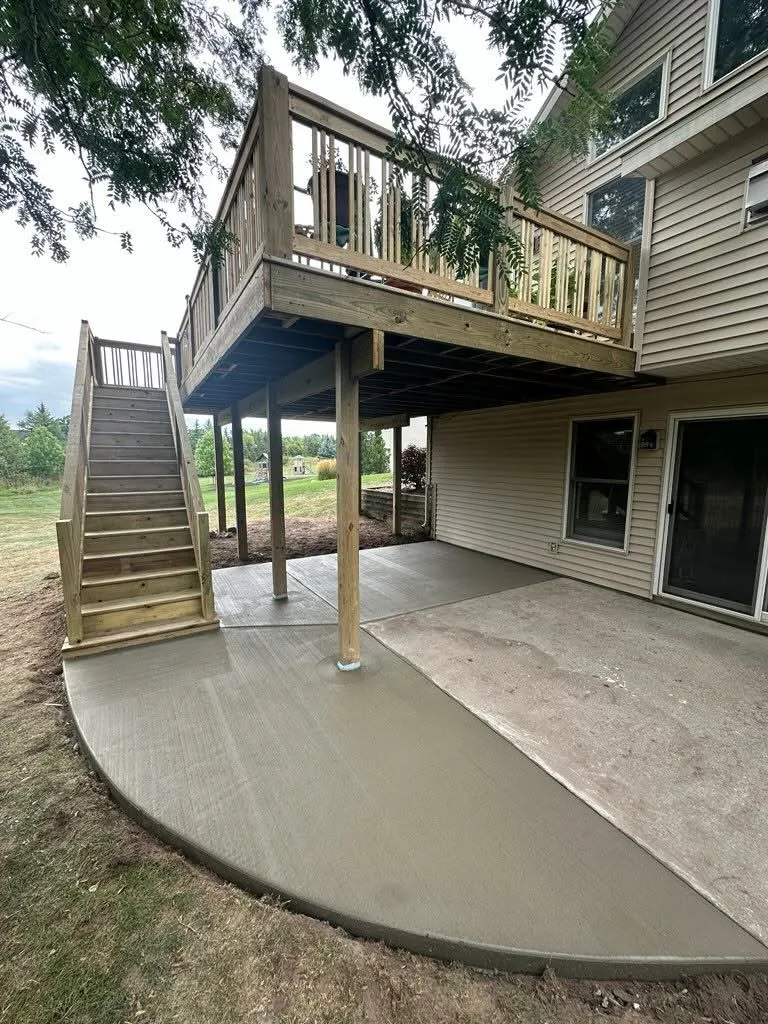 Pine Deck with Staircase to Concrete Patio & Dining Area