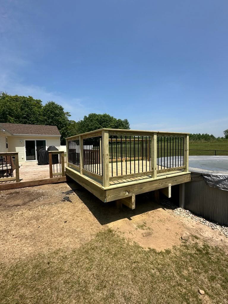 Pool Deck Addition with Black Steel Balusters — photo 1