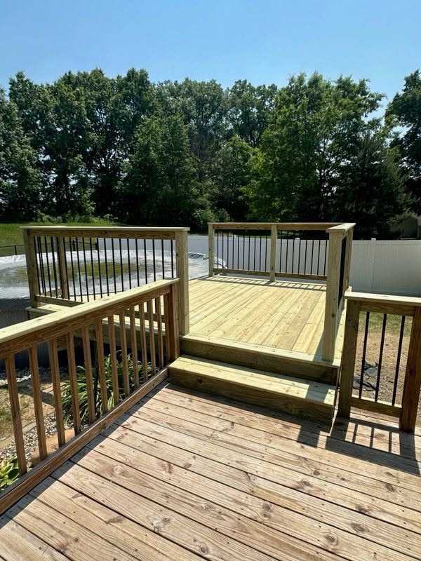 Pool Deck Addition with Black Steel Balusters — thumbnail 4