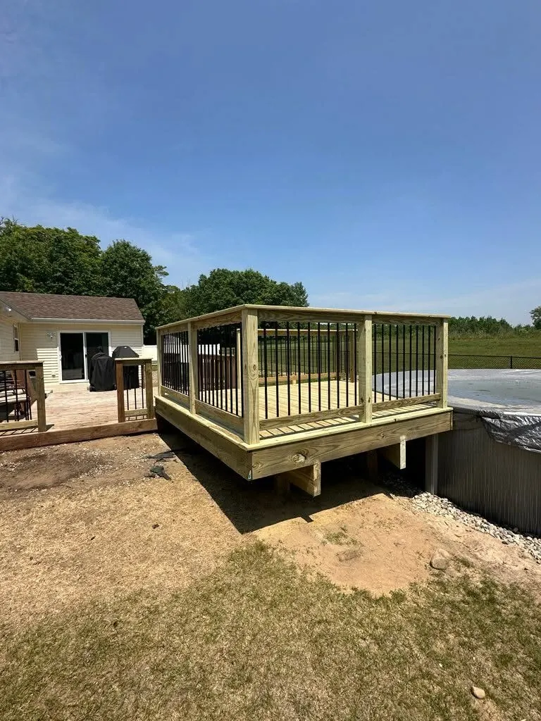 Pool Deck Addition with Black Steel Balusters — thumbnail 5