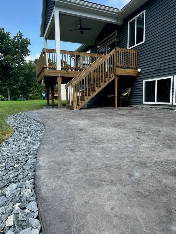 Stamped Concrete Patio Beneath a Covered Deck — thumbnail 2