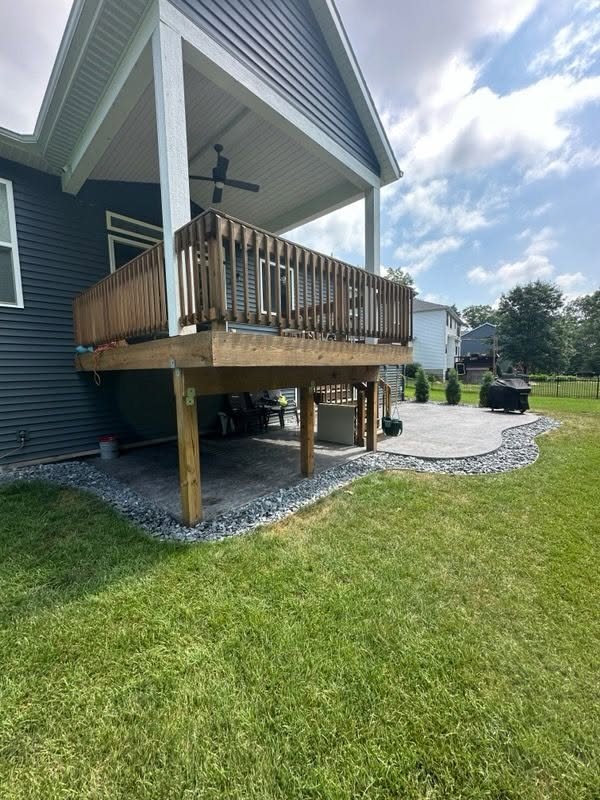 Stamped Concrete Patio Beneath a Covered Deck — thumbnail 3
