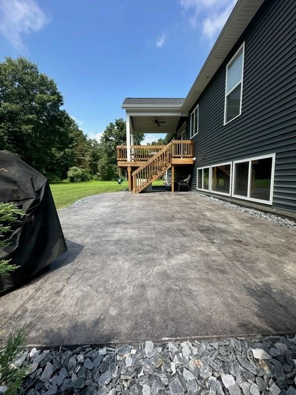 Stamped Concrete Patio Beneath a Covered Deck — thumbnail 4