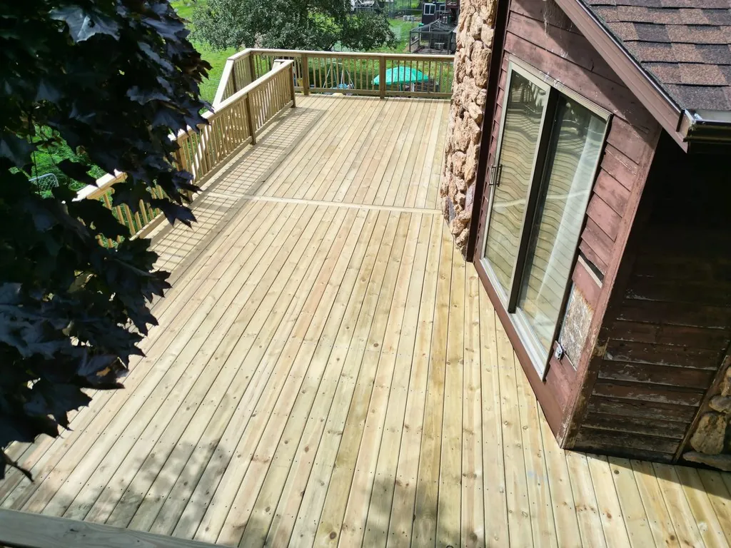 Wraparound Pressure-Treated Deck with Dual Staircases