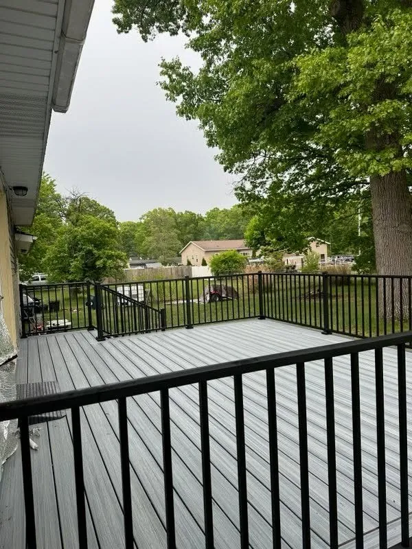 Gray Composite Deck with Black Railings — thumbnail 3