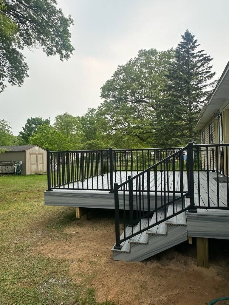 Gray Composite Deck with Black Railings — thumbnail 4