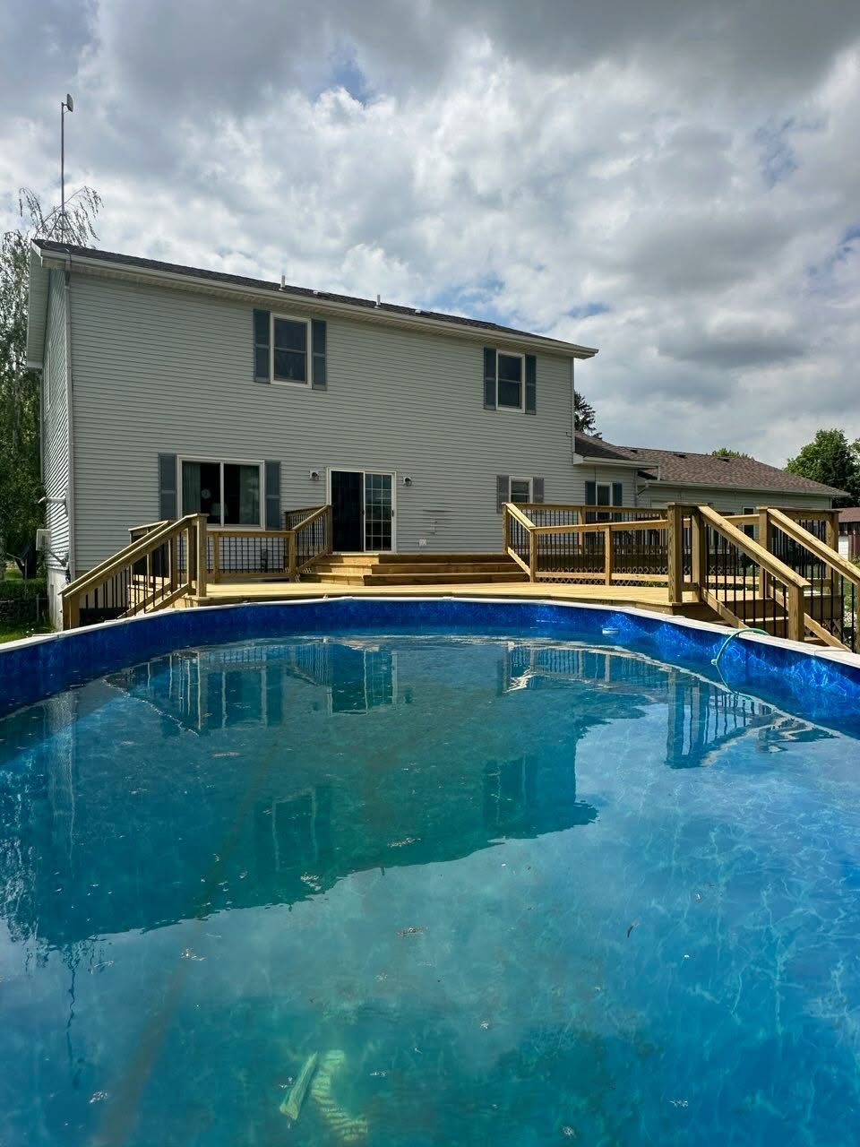 Custom Pool Deck with Black Steel Balusters